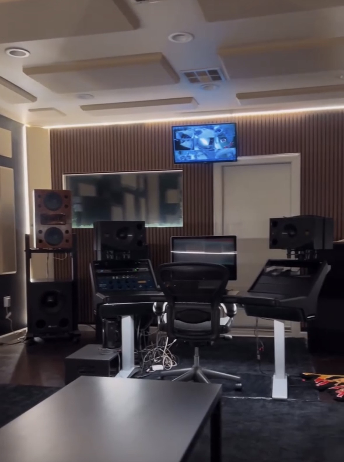 Recording room with studio monitors and acoustic panels