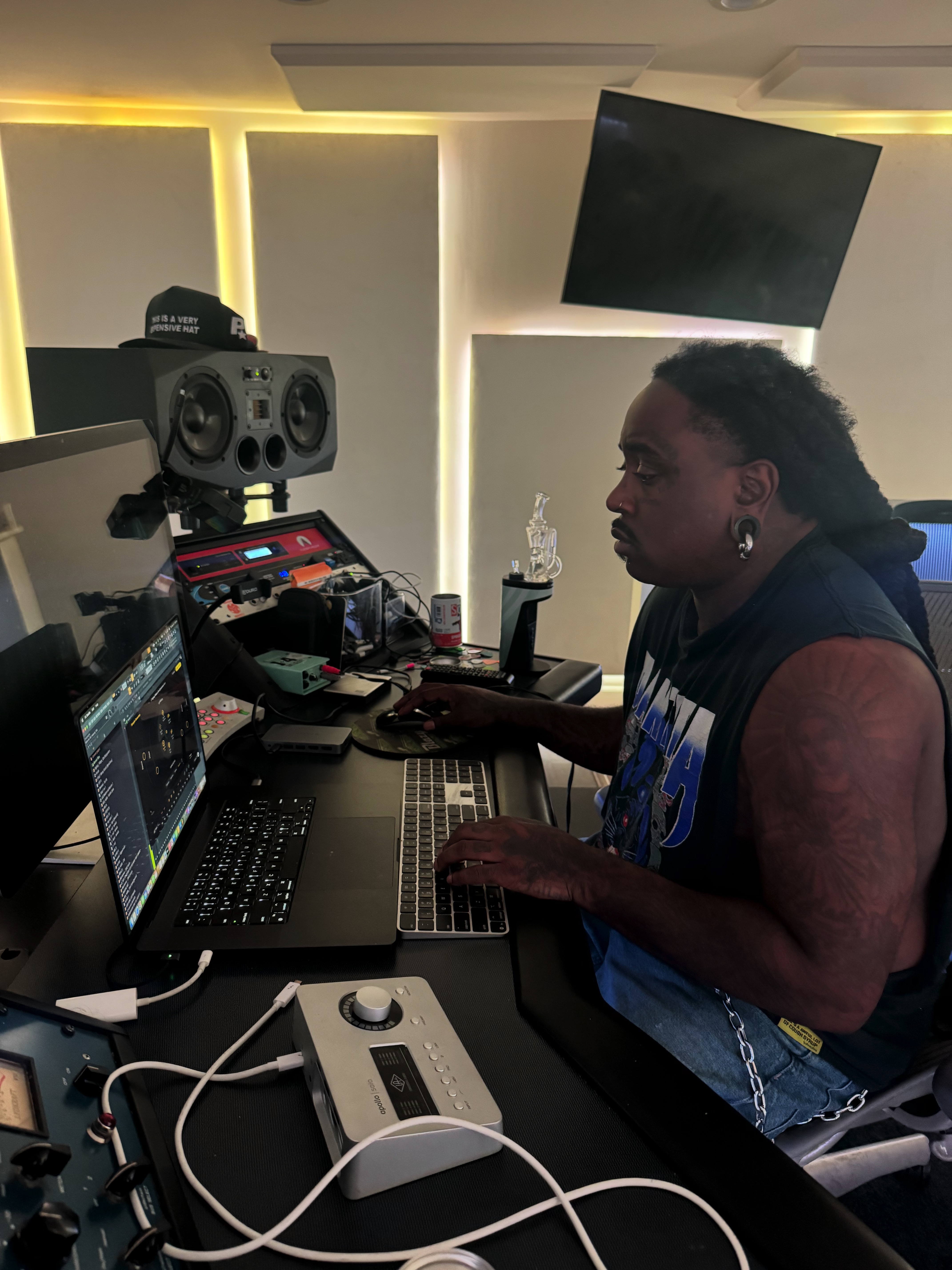 Ricky P working at the studio desk