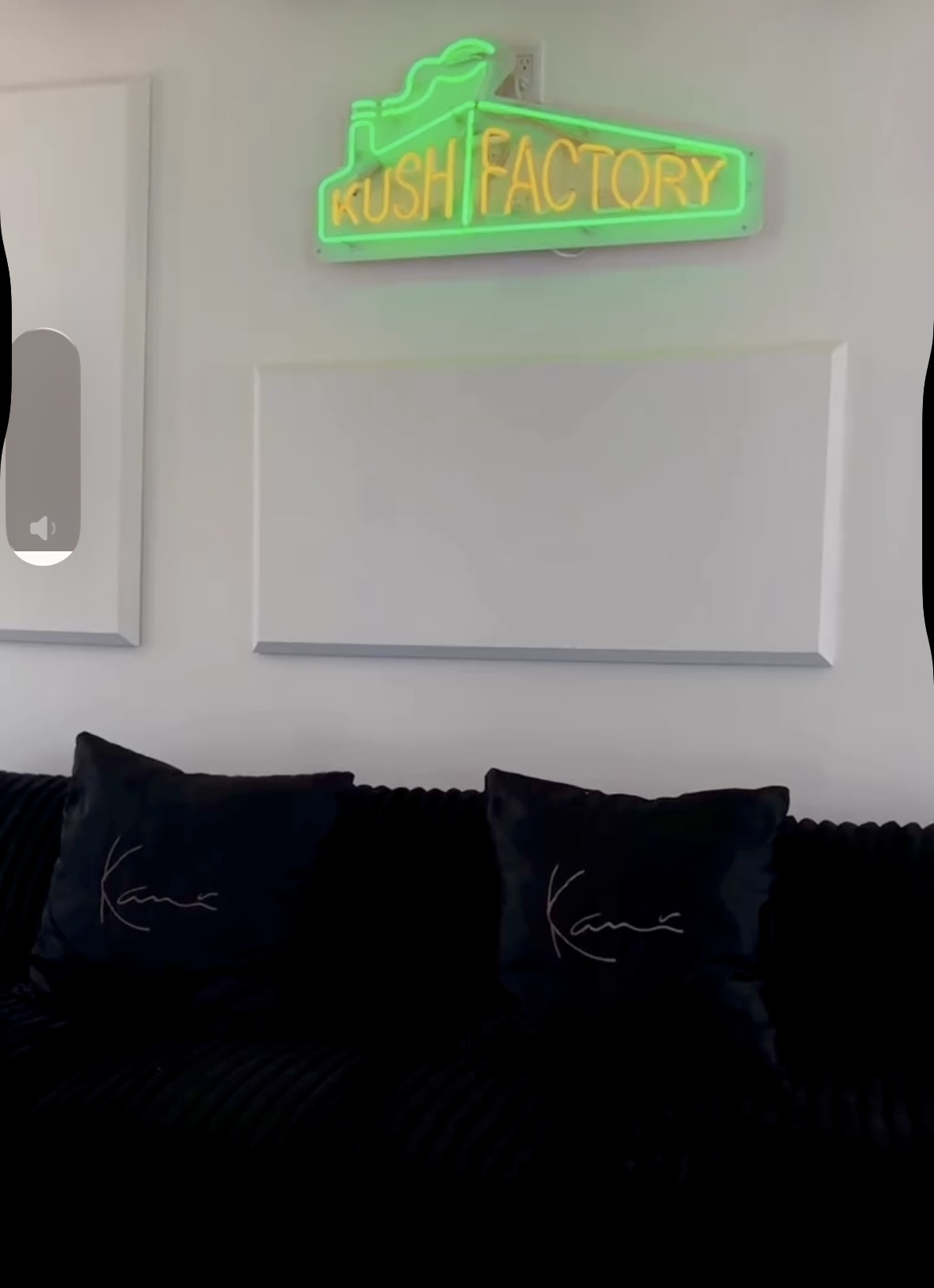 The green Kush Factory neon sign